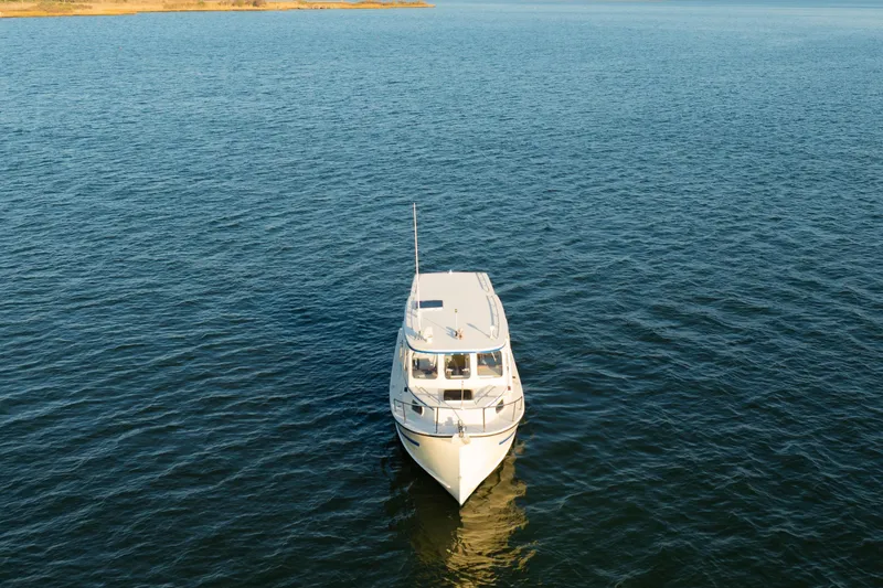 Slide: The Image of Interior of 2000 Rosborough 246LVS boat with kitchenette and wooden cabinetry. - 32