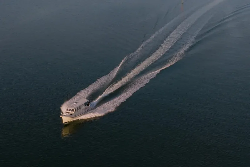 Slide: The Image of 2000 Rosborough 246LVS boat on calm blue water, aerial view. - 34