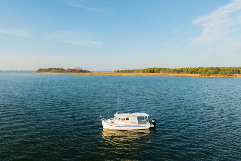 Slide: The Image of Aerial view of 2000 Rosborough 246LVS boat cruising on calm water. - 36