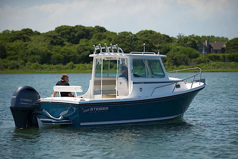 Slide: The Image of 2026 Steiger Craft 21 MIAMI boat on water, featuring Yamaha engine, with two people onboard. - 2