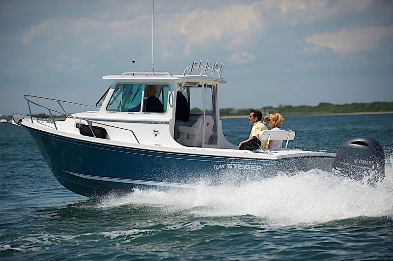 Slide: The Image of 2026 Steiger Craft 21 MIAMI boat cruising on open water with passengers. - 4