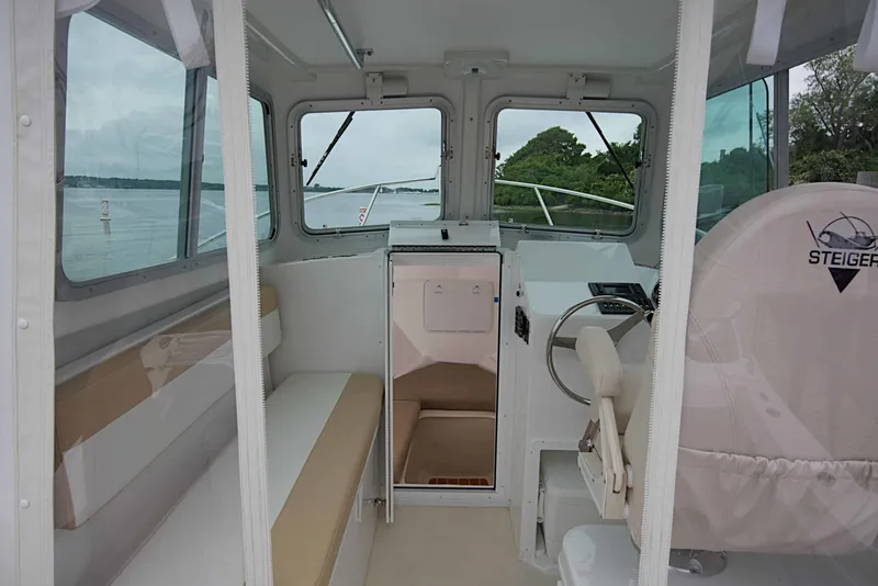 Slide: The Image of Interior of 2026 Steiger Craft 21 MIAMI boat, featuring helm and seating area. - 6