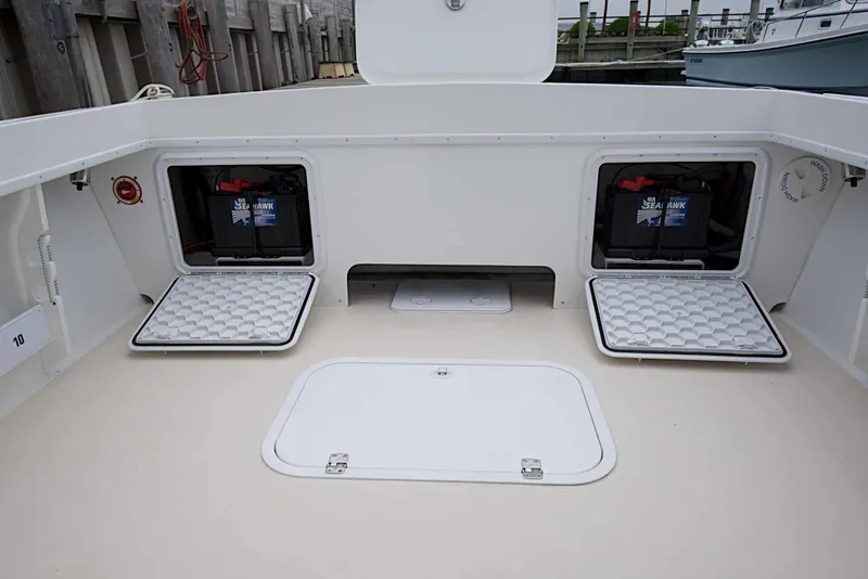Slide: The Image of 2026 Steiger Craft 21 MIAMI boat deck with open battery compartments. - 7