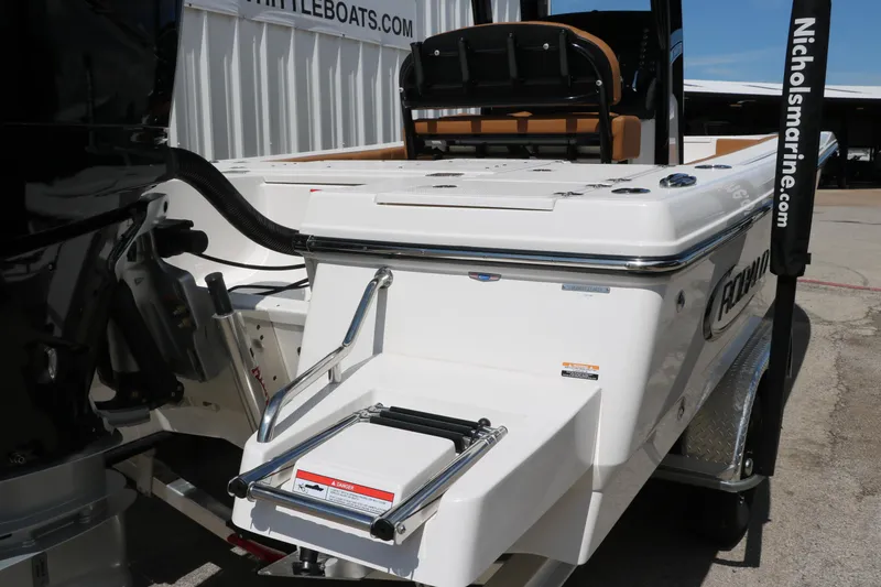 Slide: The Image of 2025 Robalo 246 Cayman boat with swim platform and ladder, displayed at Nichols Marine. - 12