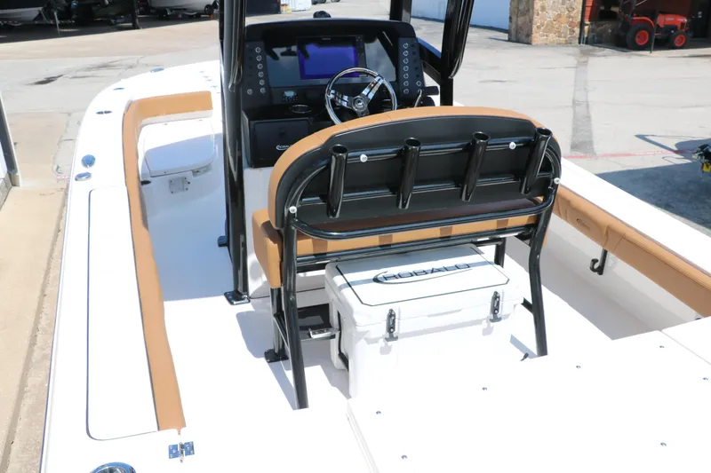 Slide: The Image of 2025 Robalo 246 Cayman boat interior with helm, seating, and storage. - 18