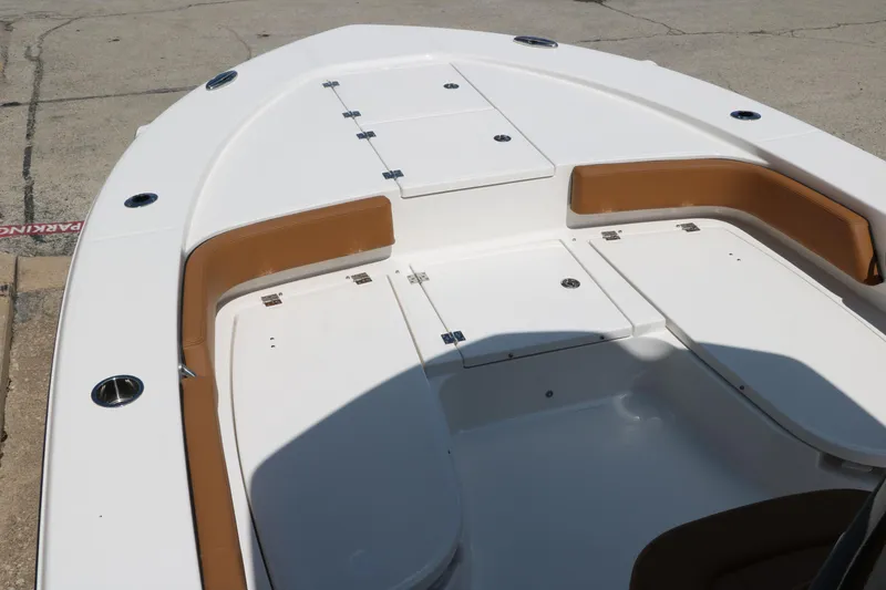 Slide: The Image of 2025 Robalo 246 Cayman boat deck with storage compartments and seating. - 20