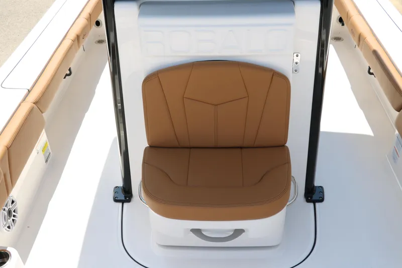 Slide: The Image of 2025 Robalo 246 Cayman boat seat with tan upholstery and sleek design. - 23