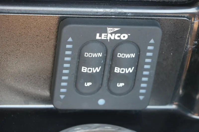 Slide: The Image of Lenco trim tab control panel on 2025 Robalo 246 Cayman boat. - 36
