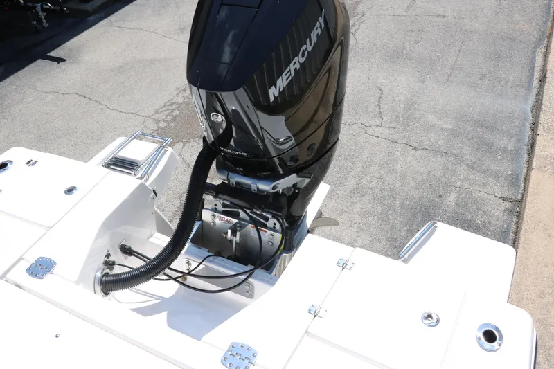 Slide: The Image of 2025 Robalo 246 Cayman boat with Mercury outboard engine, rear view. - 44