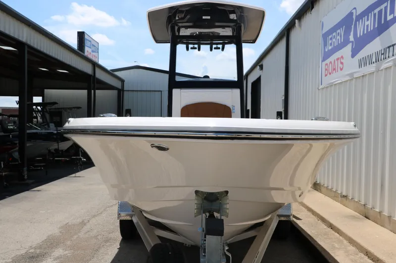 Slide: The Image of 2025 Robalo 246 Cayman boat on trailer at dealership, front view. - 7