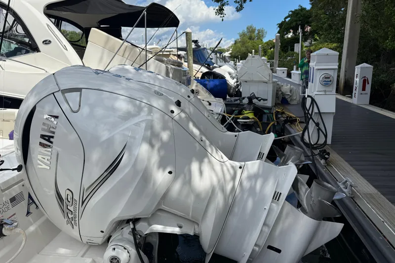 Slide: The Image of 2022 Pursuit S 358 Sport boat docked with dual Yamaha engines. - 1