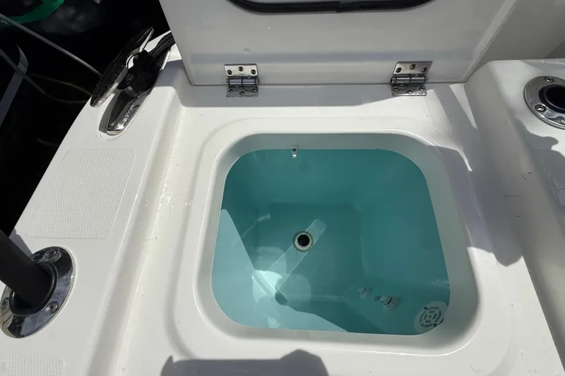 Slide: The Image of 2022 Pursuit S 358 Sport boat with fishing rod holders and livewell. - 10