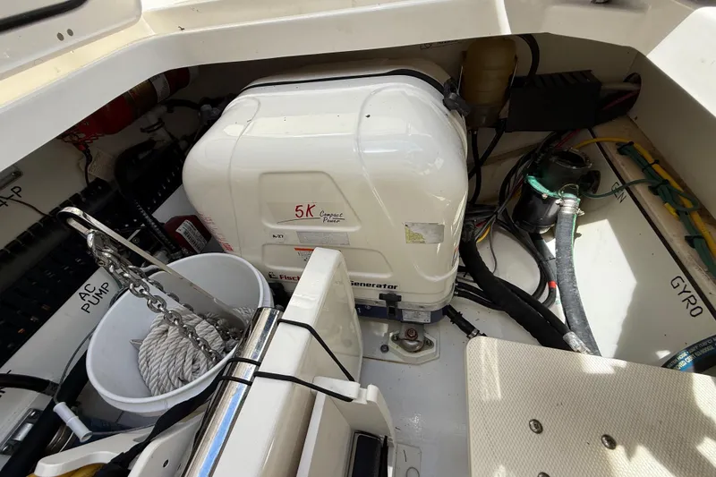 Slide: The Image of 2022 Pursuit S 358 Sport boat with cushioned seating and dual outboard motors. - 12