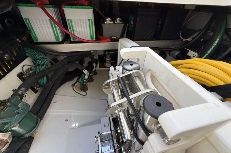 Slide: The Image of 2022 Pursuit S 358 Sport boat engine compartment with generator and equipment. - 13