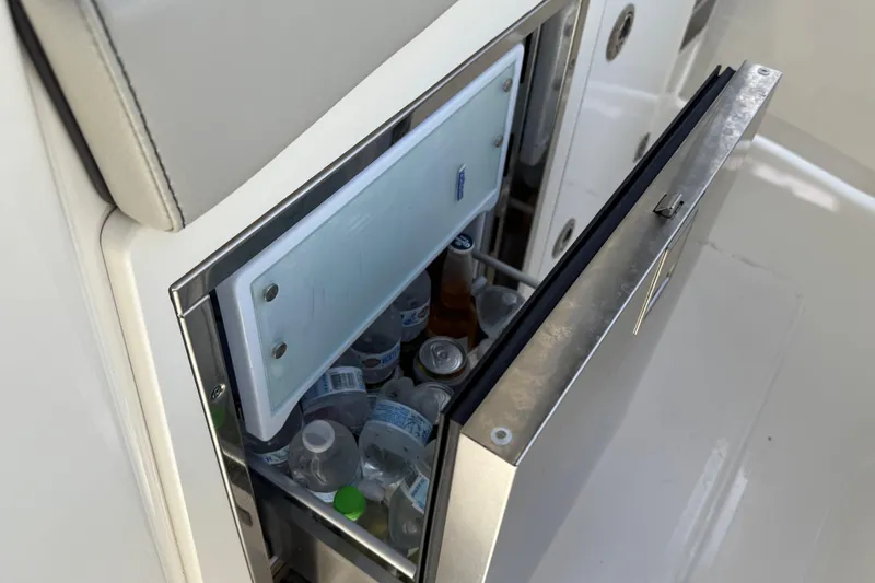Slide: The Image of 2022 Pursuit S 358 Sport boat interior detail with stainless steel compartment. - 19