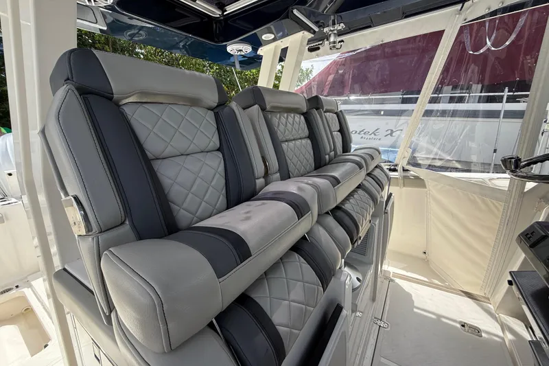 Slide: The Image of Open cooler on 2022 Pursuit S 358 Sport boat, filled with drinks and water bottles. - 20