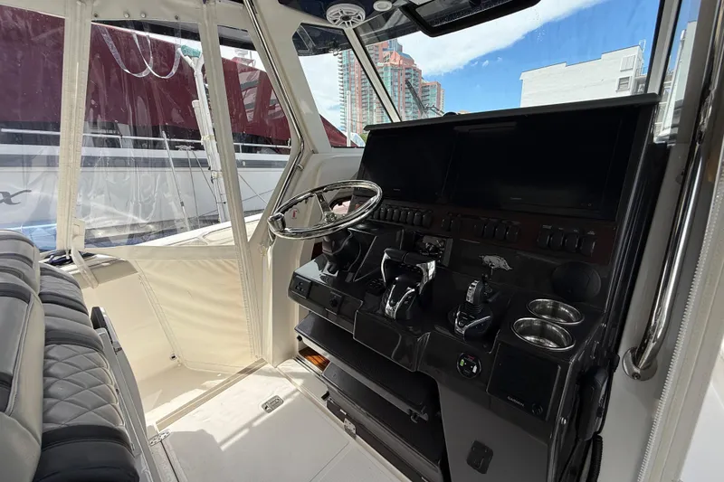 Slide: The Image of Luxurious seating on 2022 Pursuit S 358 Sport boat, featuring quilted upholstery and modern design. - 21