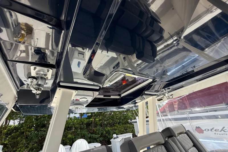 Slide: The Image of Interior view of 2022 Pursuit S 358 Sport boat with modern design and speakers. - 25