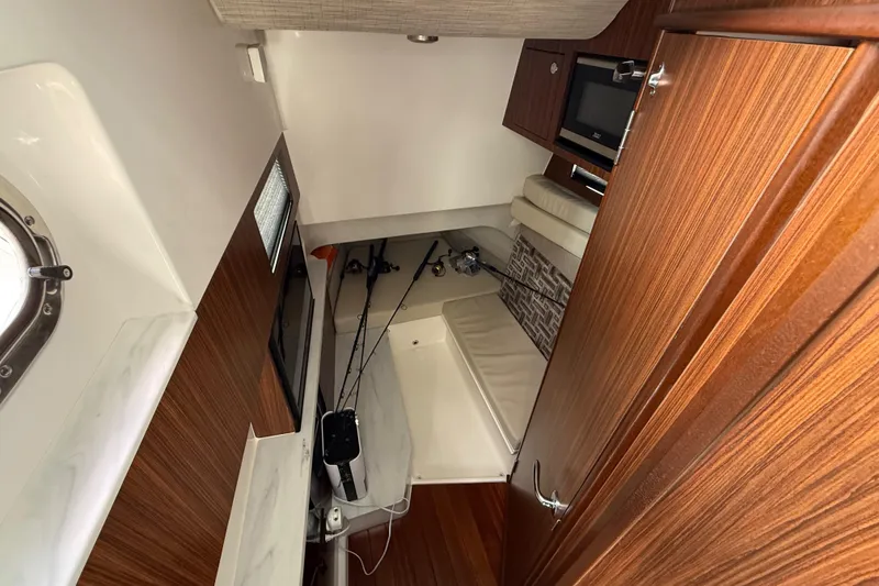 Slide: The Image of Storage compartment of 2022 Pursuit S 358 Sport boat with equipment and accessories. - 29