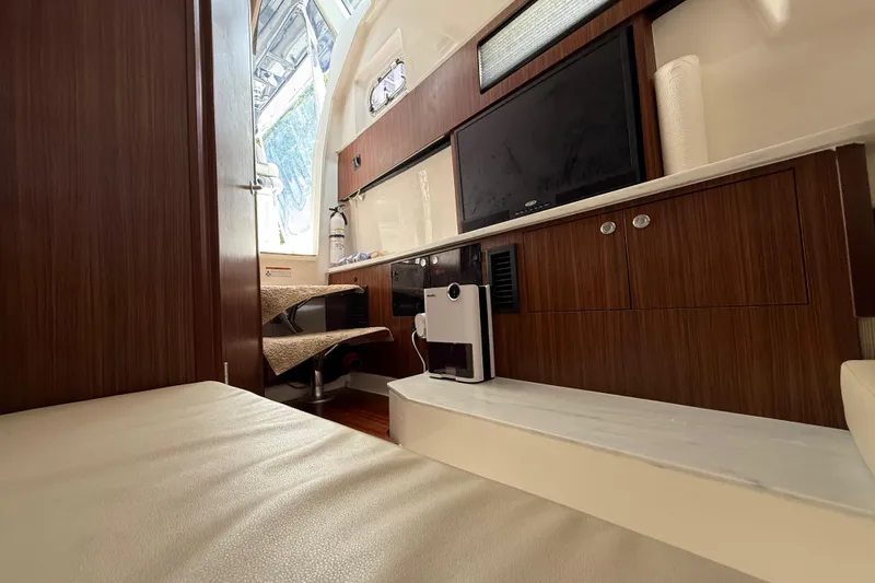 Slide: The Image of Reflection in mirror on 2022 Pursuit S 358 Sport boat interior. - 37