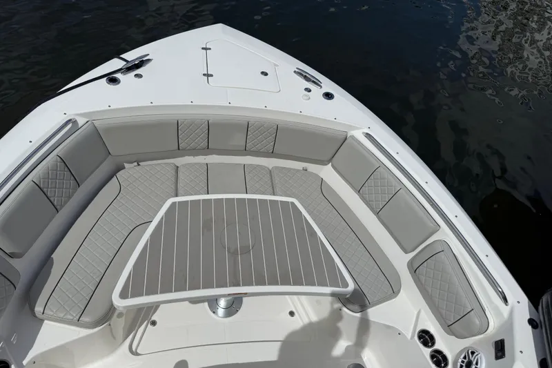 Slide: The Image of Interior of 2022 Pursuit S 358 Sport boat with modern wood cabinetry and seating. - 38