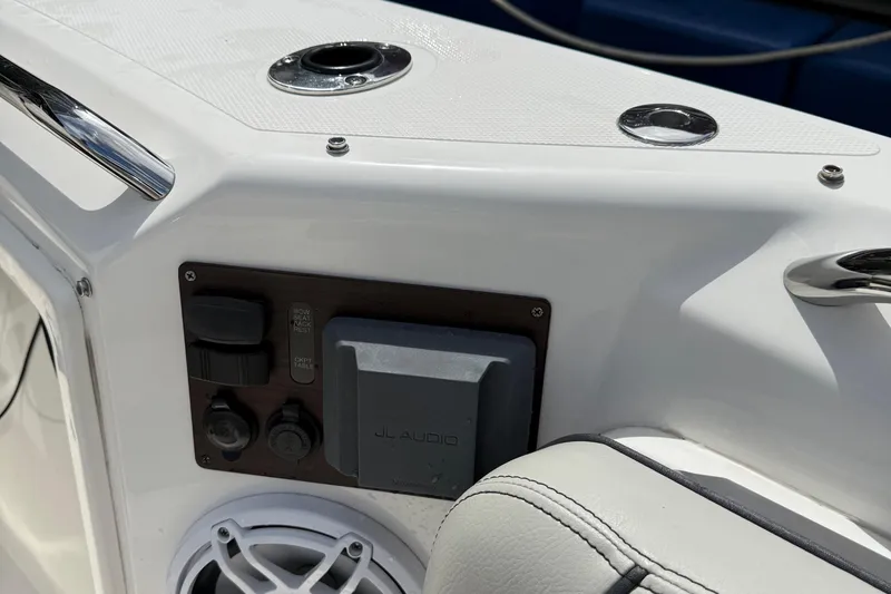 Slide: The Image of 2022 Pursuit S 358 Sport boat interior with cushioned seating and speaker system. - 41