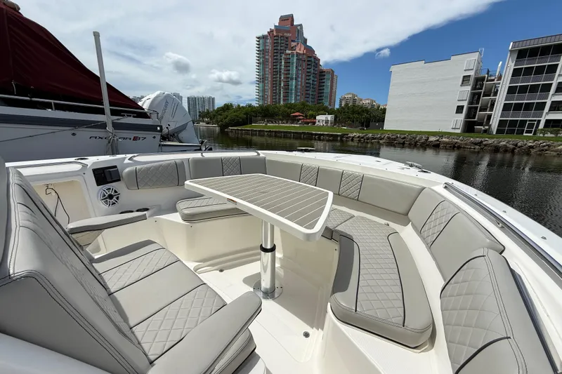 Slide: The Image of Control panel and speaker on 2022 Pursuit S 358 Sport boat. - 42