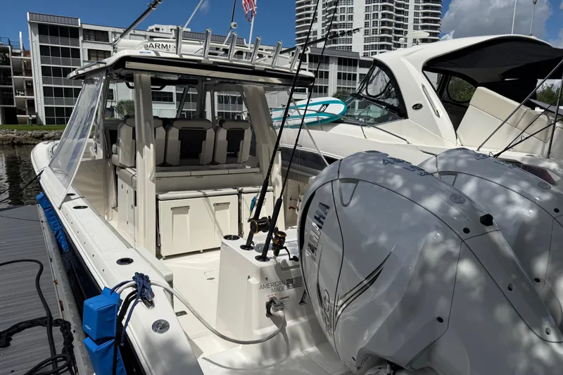 Slide: The Image of 2022 Pursuit S 358 Sport boat docked with Yamaha outboard engine. - 5