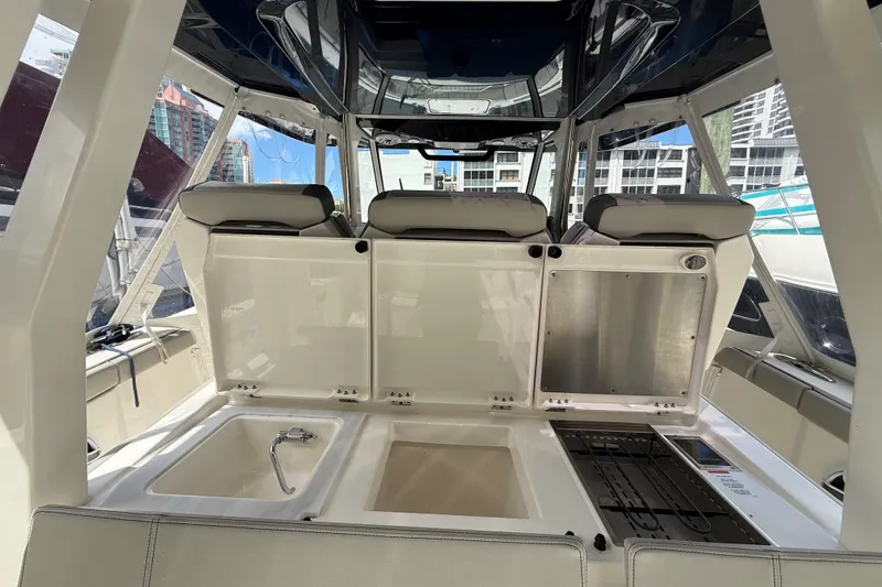 Slide: The Image of 2022 Pursuit S 358 Sport boat interior with luxurious seating and modern design. - 8