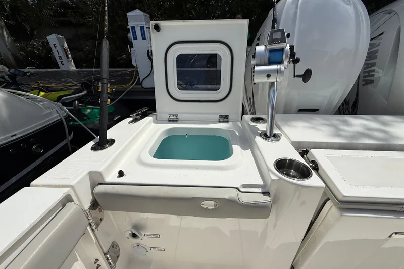 Slide: The Image of 2022 Pursuit S 358 Sport boat interior with seating and storage compartments. - 9