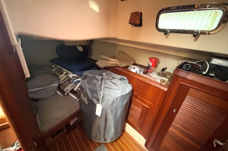 Slide: The Image of Interior cabin of 2001 Island Packet 380 sailboat with storage and equipment. - 14
