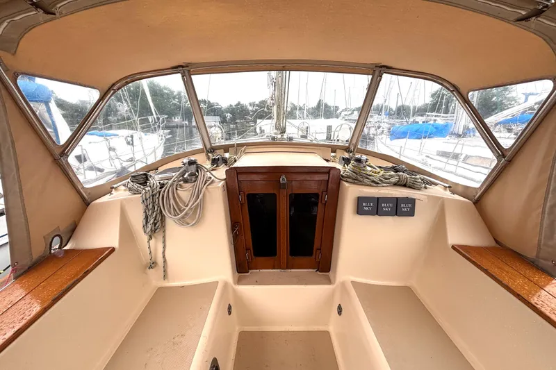 Slide: The Image of Cockpit of 2001 Island Packet 380 sailboat with ropes and wooden accents. - 15