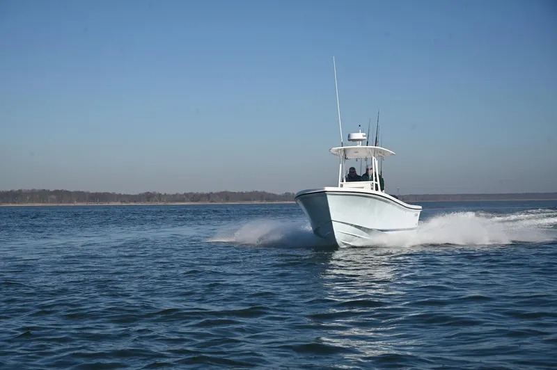 Slide: The Image of 2026 Steiger Craft 255 Tournament boat cruising on open water. - 2