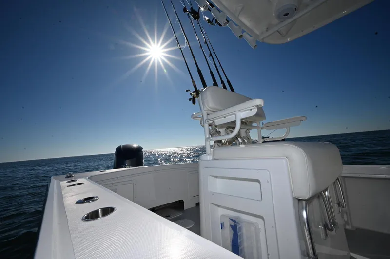 Slide: The Image of 2026 Steiger Craft 255 Tournament boat under bright sun on open water. - 5