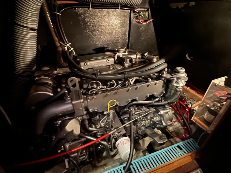 Slide: The Image of Engine compartment of a 2000 Jeanneau Sun Odyssey 45.2 sailboat, showcasing detailed mechanical components. - 17