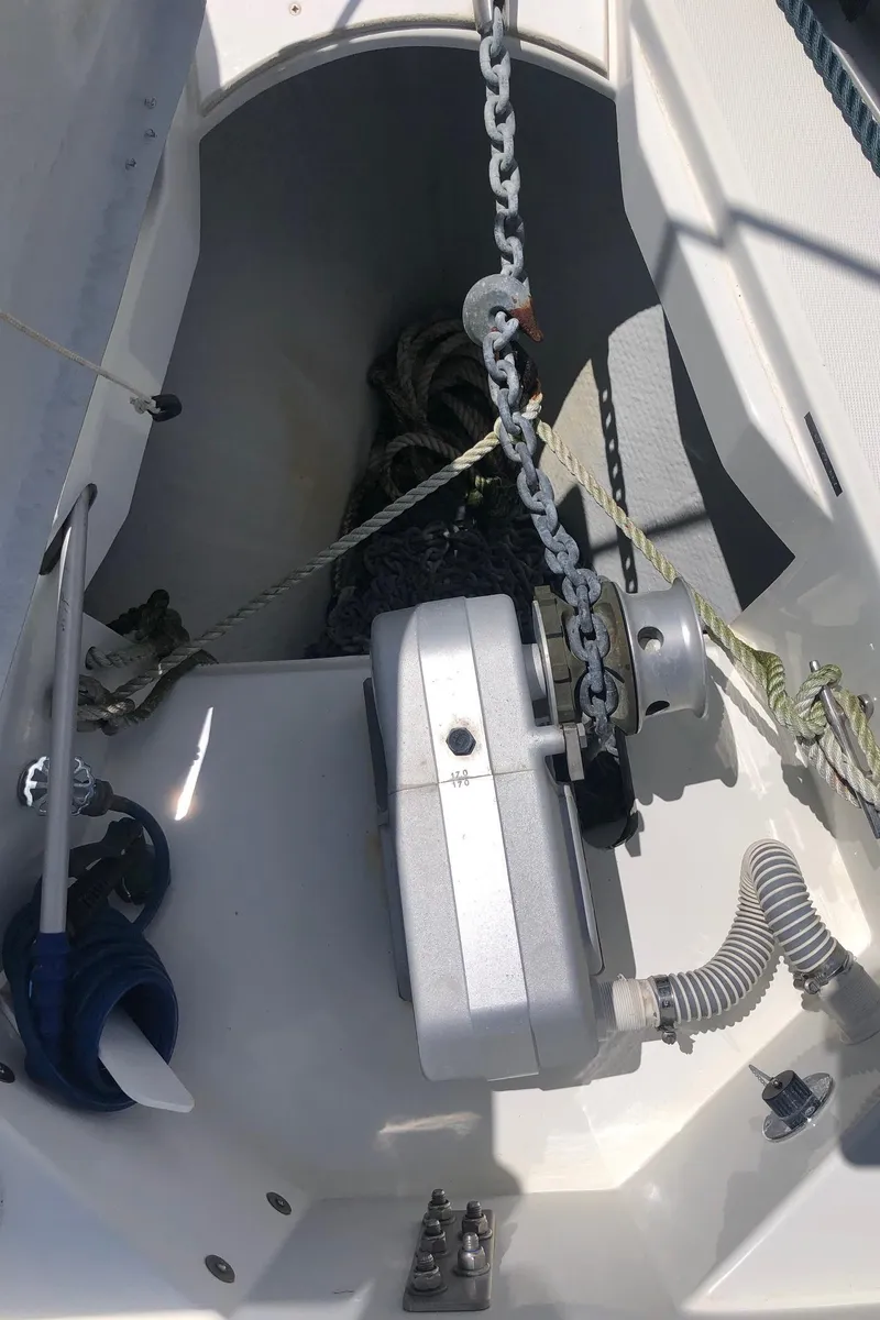 Slide: The Image of Anchor chain and winch on Jeanneau Sun Odyssey 45.2 sailboat, 2000 model. - 19