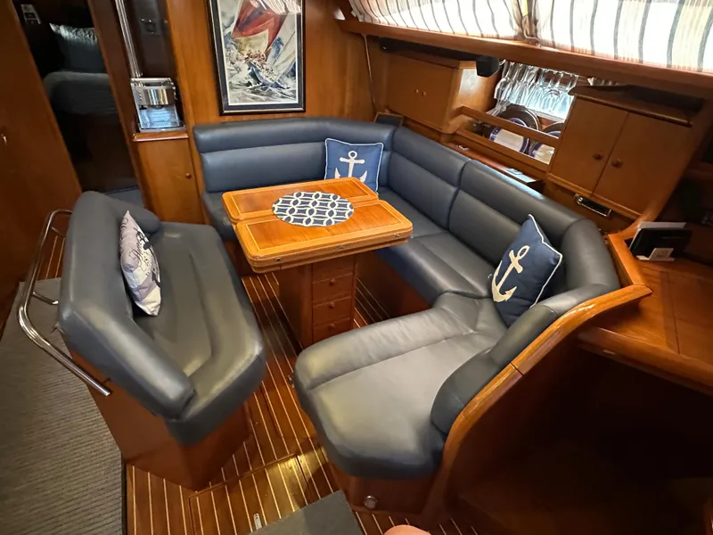 Slide: The Image of Luxurious interior of 2000 Jeanneau Sun Odyssey 45.2 yacht with elegant seating and nautical decor. - 2