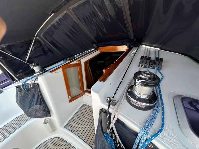 Slide: The Image of Cockpit view of 2000 Jeanneau Sun Odyssey 45.2 sailboat with winch and ropes. - 24