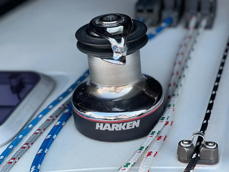 Slide: The Image of Harken winch on Jeanneau Sun Odyssey 45.2 sailboat, 2000 model, with colorful ropes. - 27