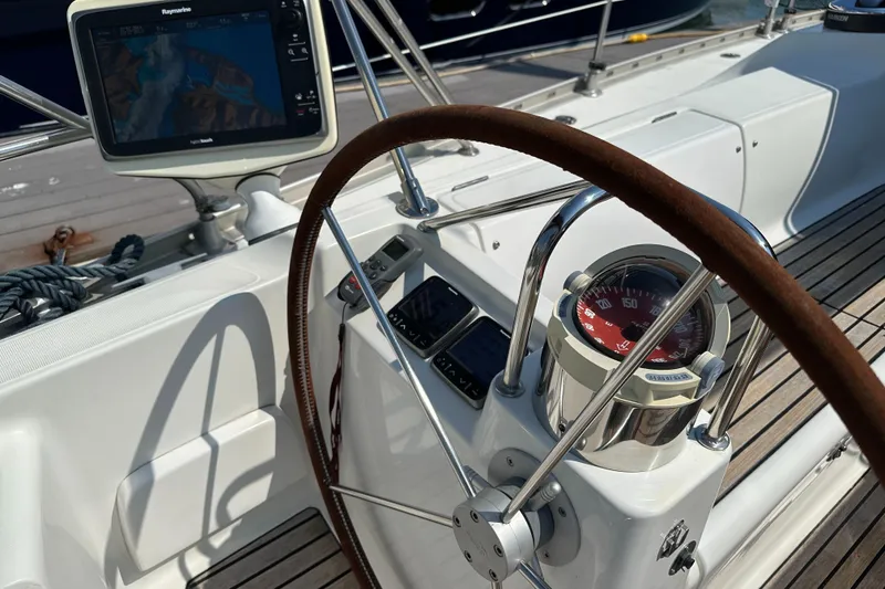 Slide: The Image of Steering wheel and navigation equipment on a 2000 Jeanneau Sun Odyssey 45.2 sailboat. - 30