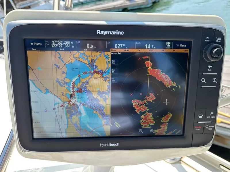 Slide: The Image of Raymarine navigation display on Jeanneau Sun Odyssey 45.2, showing map and radar data. - 31