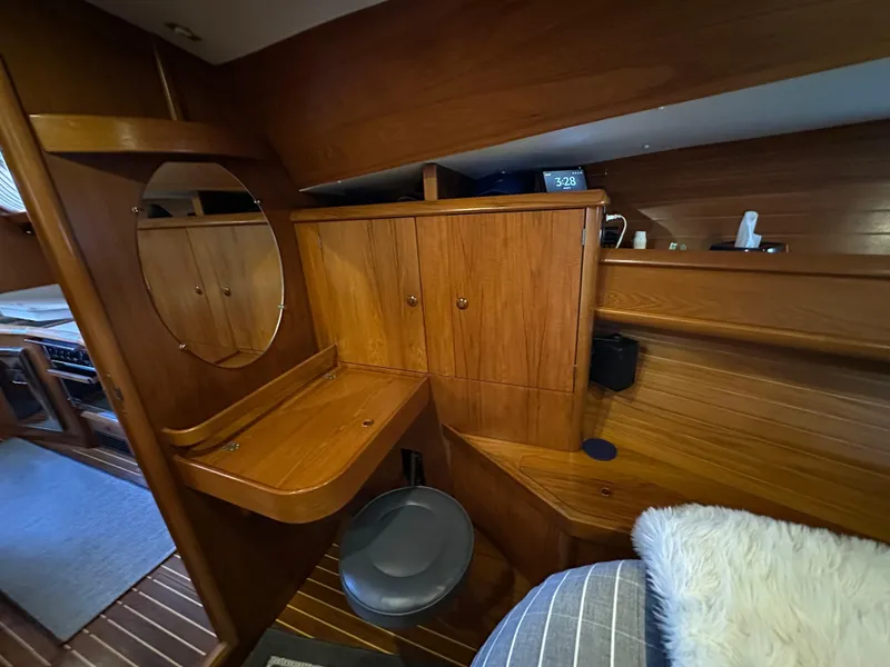Slide: The Image of Interior of 2000 Jeanneau Sun Odyssey 45.2 yacht with wooden cabinetry and seating. - 5