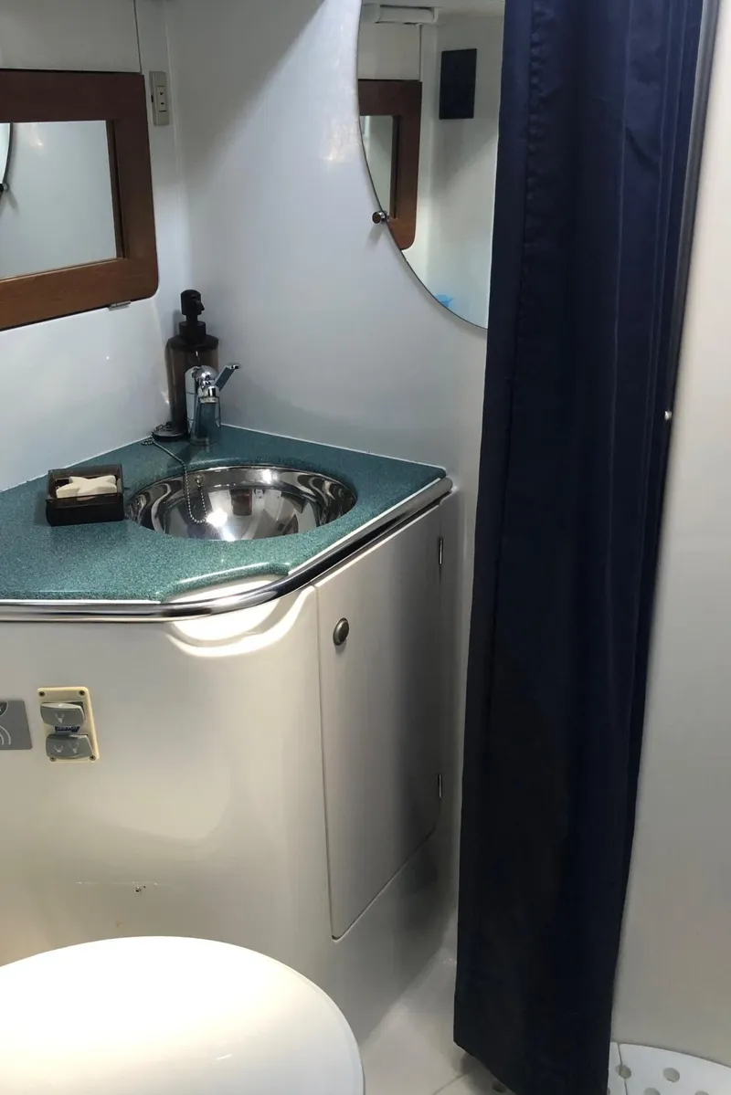 Slide: The Image of Bathroom interior of 2000 Jeanneau Sun Odyssey 45.2 yacht with sink and mirror. - 7