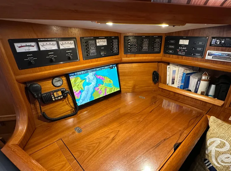 Slide: The Image of Navigation station of 2000 Jeanneau Sun Odyssey 45.2 with control panels and chart display. - 8