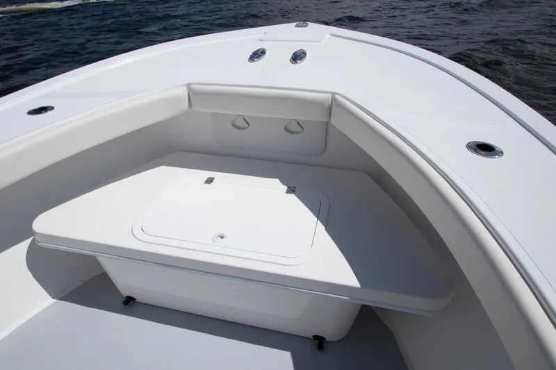 Slide: The Image of 2026 Steiger Craft 23 Tournament boat interior with seating and storage, on open water. - 10