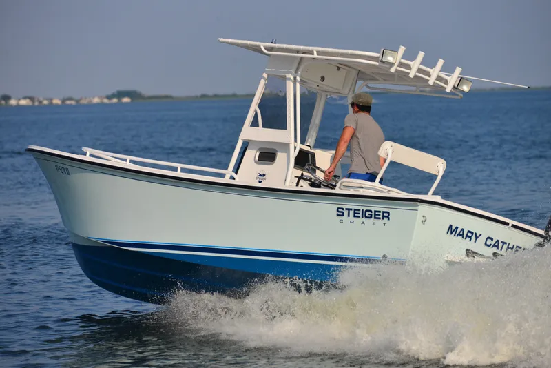 Slide: The Image of 2026 Steiger Craft 23 Tournament boat cruising on open water. - 4