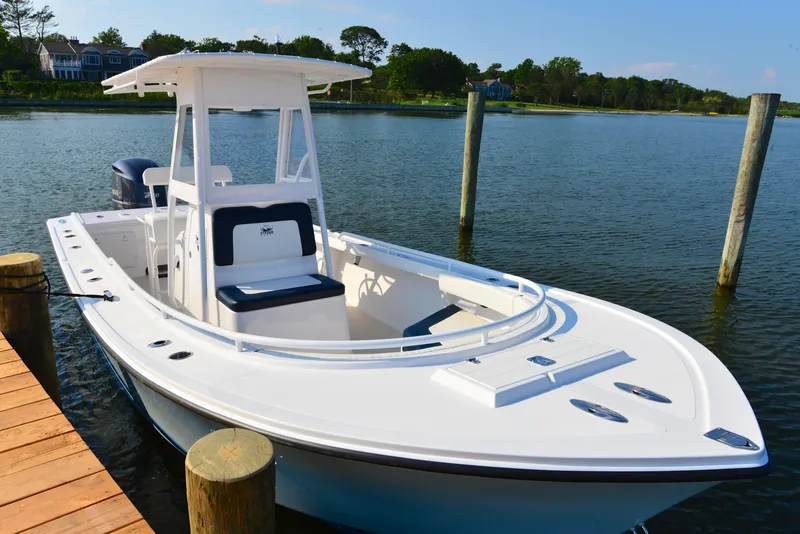 Slide: The Image of 2026 Steiger Craft 23 Tournament boat docked on calm water. - 7