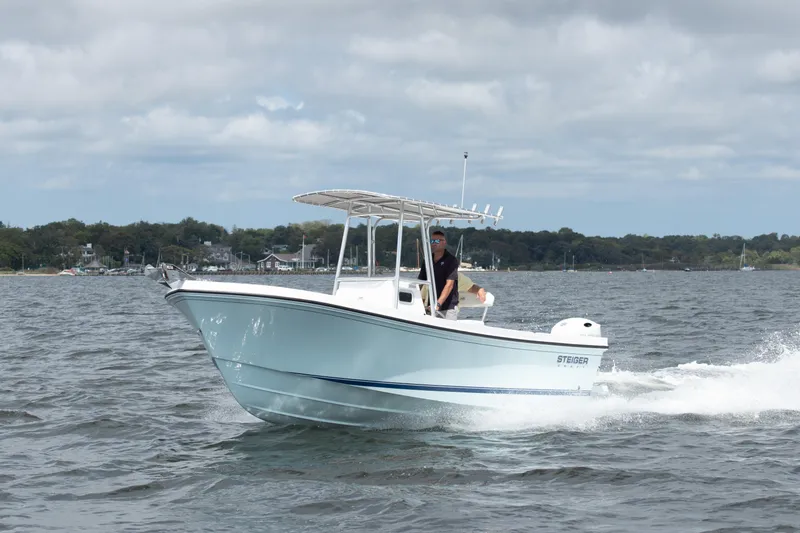 The Image of 2026 Steiger Craft 21 Tournament boat cruising on open water under cloudy skies. - 1