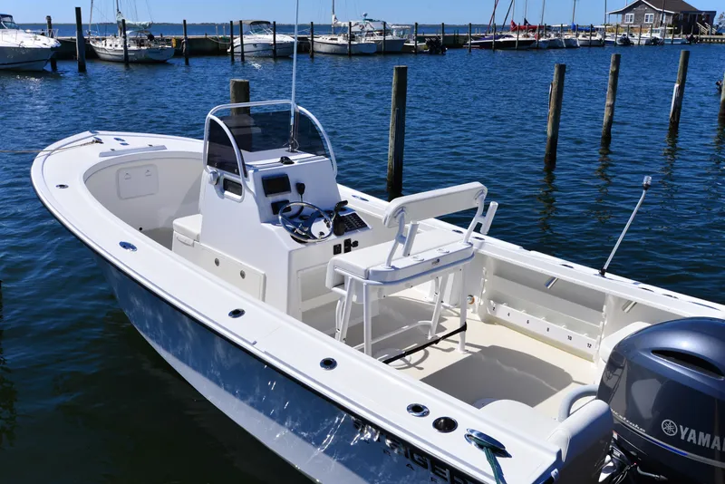 Slide: The Image of 2026 Steiger Craft 21 Tournament boat docked in a marina, featuring a sleek design and Yamaha engine. - 10