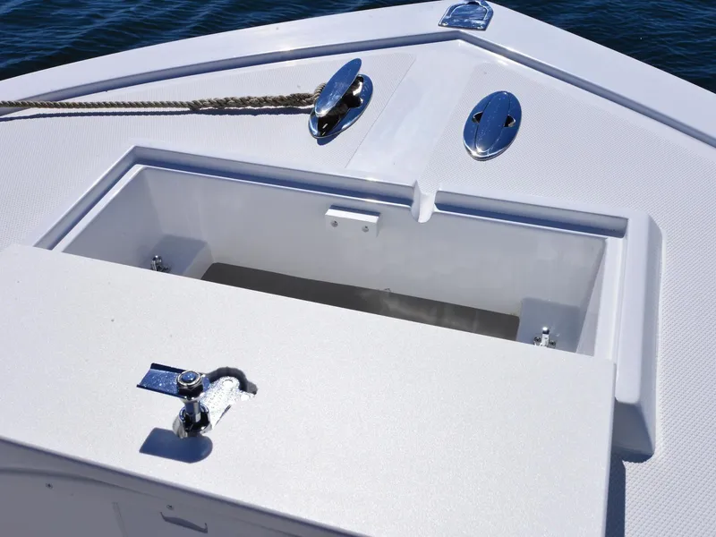 Slide: The Image of 2026 Steiger Craft 21 Tournament boat deck with open storage compartment. - 11